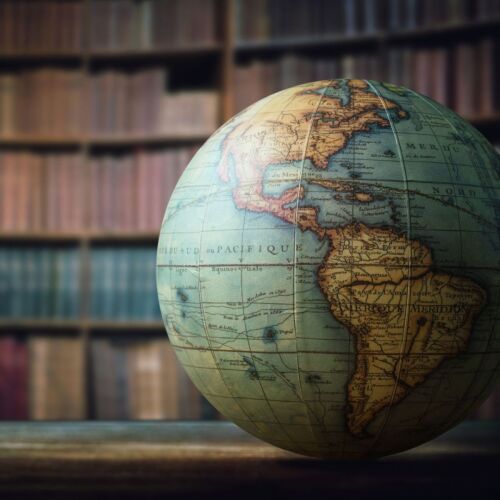 Globe with books in background