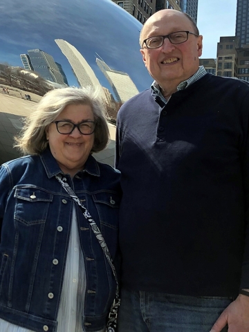 Donna and Tom Ioppolo standing in front of the Bean in Chicago