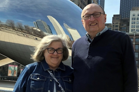 Donna and Tom Ioppolo standing in front of the Bean in Chicago