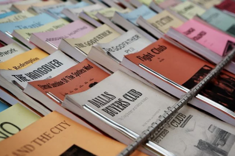 Colorful playbooks displayed on a table