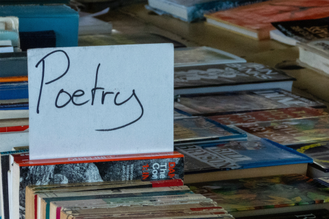 A sign reading "poetry."