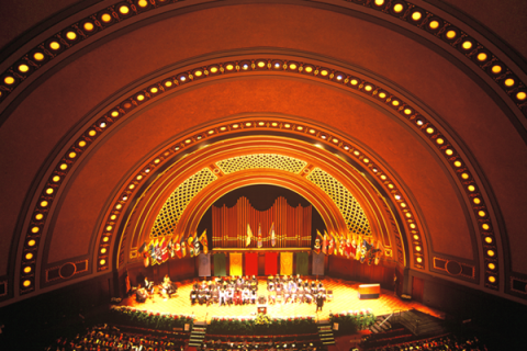 A symphony orchestra on stage at the Hill Auditorium and Concert Hall at the University of Michigan.